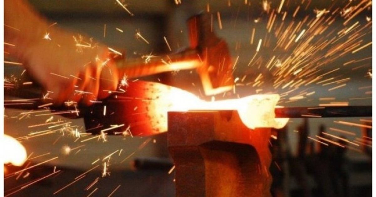 Sparks flying from steel being forged